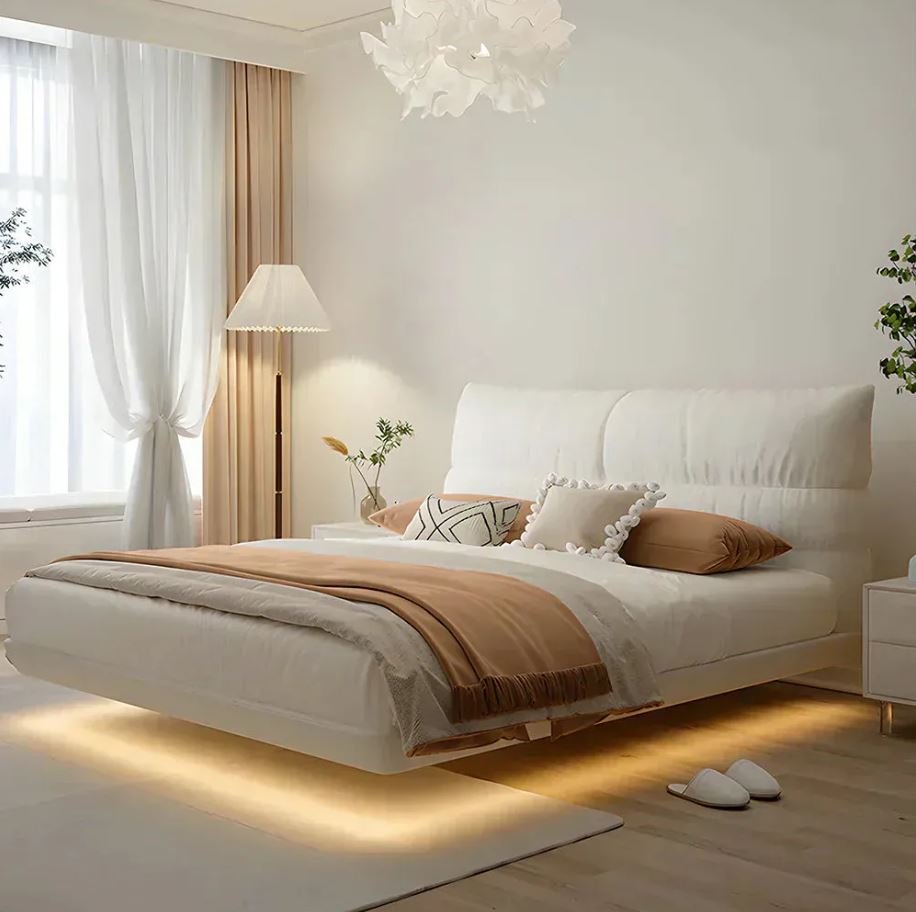 Floating bed with warm LED lighting underneath in a modern bedroom